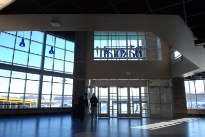 THIS IS THE LOBBY OF THE ICE CENTER FROM THE INSIDE LOOKING OUT TOWARD THE PARKING LOT