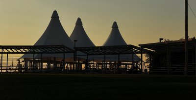 THE POW WOW GROUNDS ON A HILL NEAR THE WIND TURBINE AT SUNSET