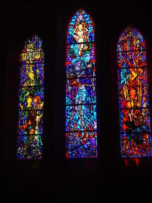 THE COLORED LIGHT FROM THE WINDOWS FILLED THE CATHEDRAL