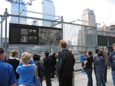 THE CROWDS SHOWED RESPECT AS THEY READ THE SIGNS ON THE MEMORIAL FENCE AT GROUND ZERO