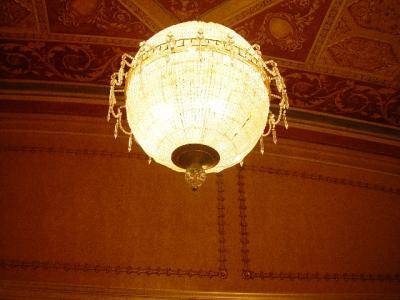 AN ELABORATE CHANDELIER IN THE THEATRE