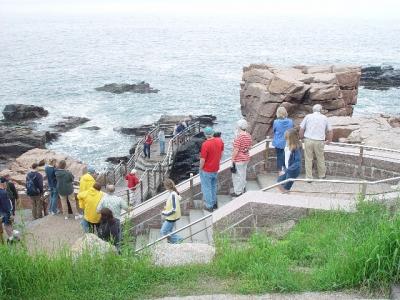 VISITORS TO THUNDER HOLE ON A SUNNY DAY