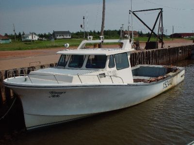 THIS BOAT IS RIGGED TO HARVEST OYSTERS AND MUSSELS