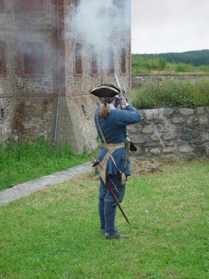A MUSKET FIRING DEMONSTRATION WAS LOUD AND SMOKEY