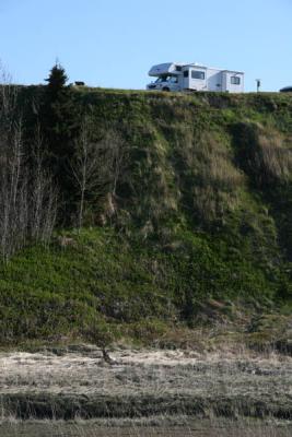 View of our RV on the bluff from beach in Kenai