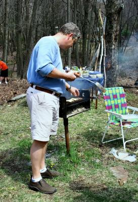 burgers undergoing the cheesing process