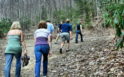 Hunter decides to enhance her walk by going barefoot through the rocks and ruts