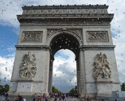 Passing the Arc de Triomphe (1806-36) after a Rainstorm in Paris