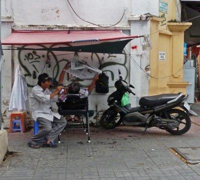 Street Barber in Saigon
