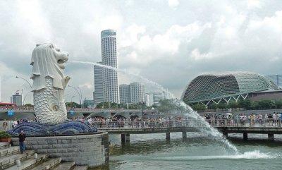 Merlion Statue with Singapore Performing Arts Center in the Background