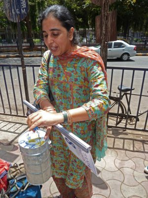 Yamani Points Out the Dabbawallah Marking System on Meal Container