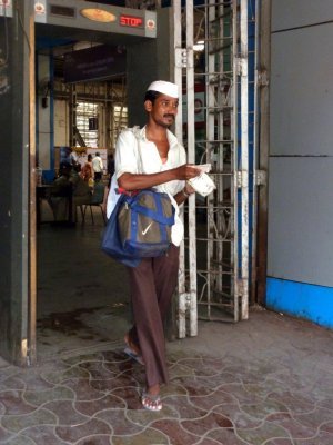 A Dabbawallah Arrives by Train at Churchgate Station