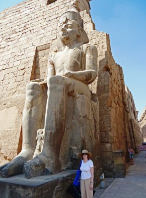Susan beside a Statue of Ramses II at the Entrance to Luxor Temple