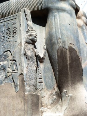 Nefertiti beside the Calf of Ramses II Statue at Luxor Temple