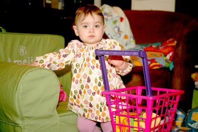 Perfect! Sitting in her chair while holding the cart