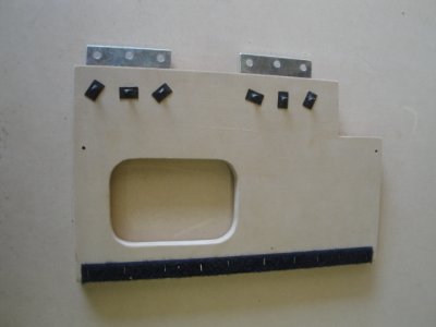 Back side of hinged panel with industrial velcro to hold amp down.