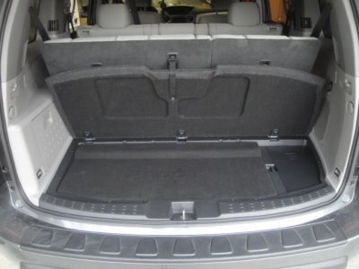 Rear cargo cover lifts as usual (locking latch removed)