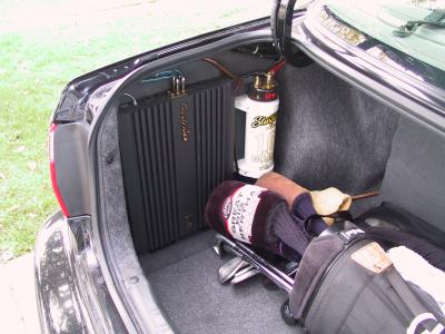 Amp and capacitor on a custom trunk panel.  Passive crossovers are on the back side of the panel.
