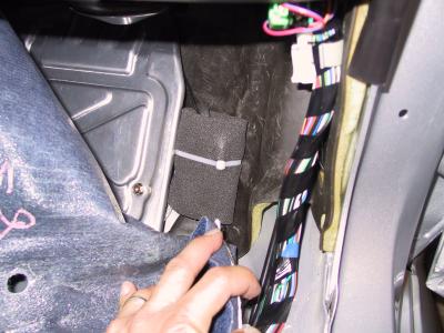 Ground distribution block @ passenger kick, wrapped and tied with foam.