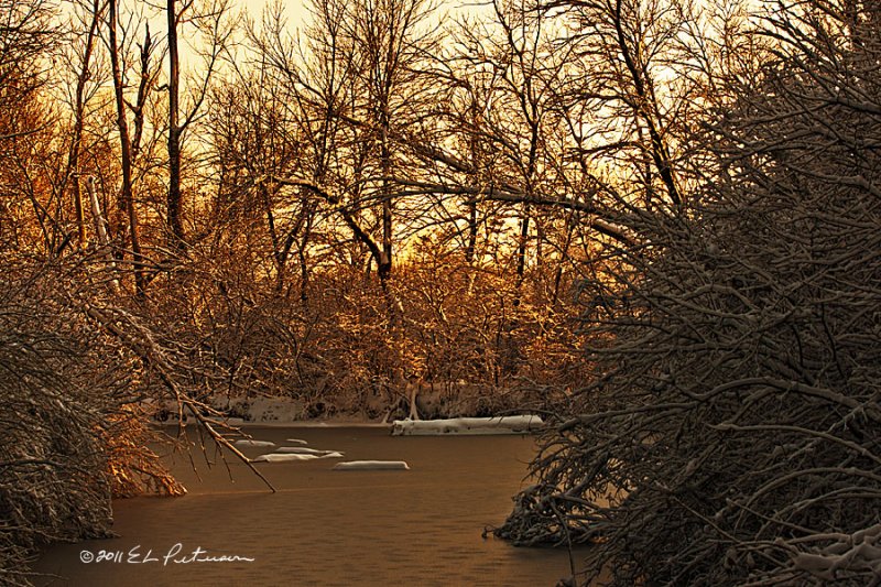 A frozen pond and a sunset in winter, a little cold but very pretty.
An image may be purchased at http://edward-peterson.artistwebsites.com/featured/frozen-pond-edward-peterson.html 