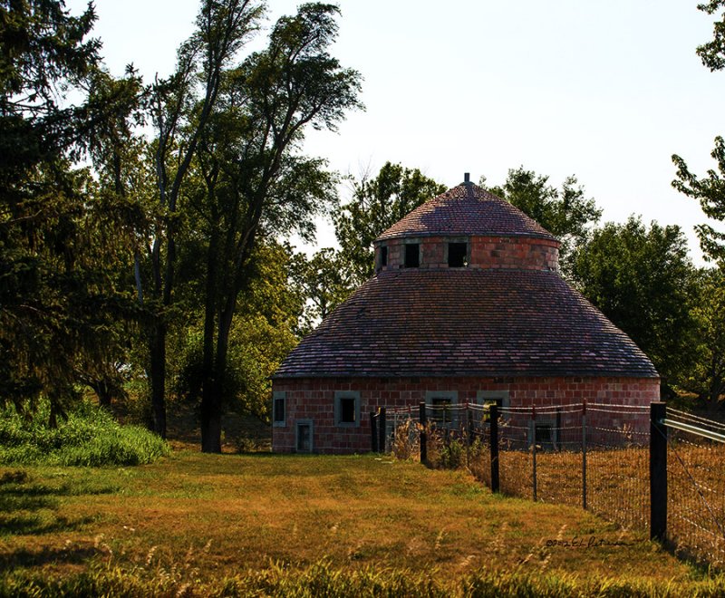 Not many round barns exist today but this old red block one is still standing.
An image may be purchased at http://edward-peterson.artistwebsites.com/featured/old-round-barn-edward-peterson.html