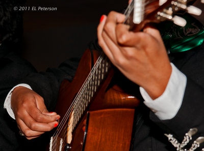 The working fingers of a Mariachi band.