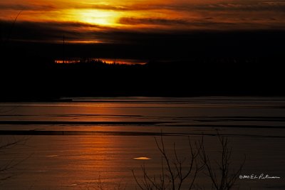 The warm winter has produced some ice melt on the lake and the setting sun seems to have picked up the open patches of ice.
An image may be purchased at http://edward-peterson.artistwebsites.com/featured/warm-winter-sunset-edward-peterson.html