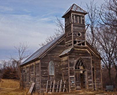 You can tell this was built for the country farmers to come and worship as it is built in the rual area.
An image may be purchased at http://edward-peterson.artistwebsites.com/featured/abandoned-church-edward-peterson.html