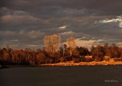 A beautiful cloudy day with the sun going down on the lake.
An image may be purchased at http://edward-peterson.artistwebsites.com/featured/cloudy-sunset-edward-peterson.html
