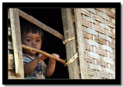Baby Behind Banboo Bars, Luangprabang Province, Laos.jpg