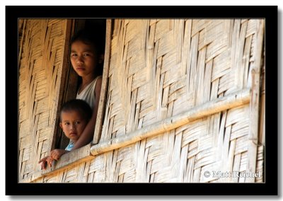 Sister and Brother Peering Out, Oudomxai, Laos