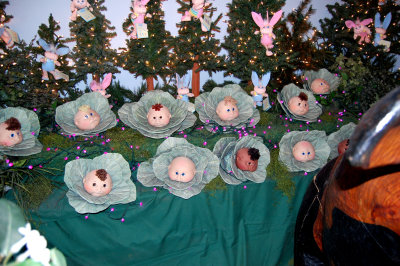 Original Cabbage Patch baby heads in the cabbage patch display