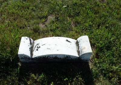Stone with something on the side not legible Section 4 Row 9