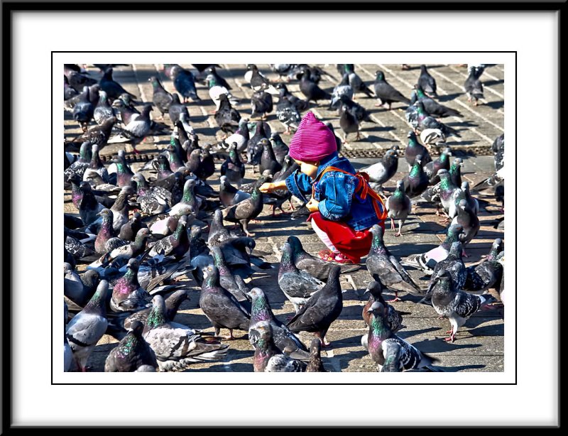 couldnt resist a shot of this cute little girl feeding the pigeons...