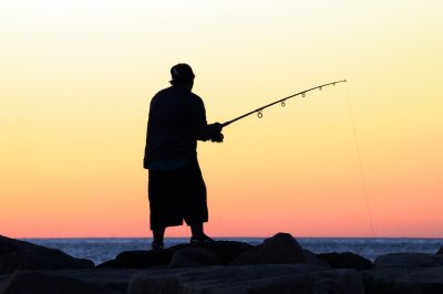 Fishing  the breakwater in  Narraganset at sunrise