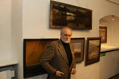 Portrait among paintings