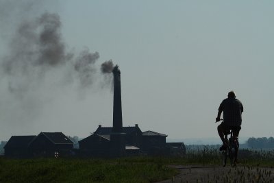 Cyclist by pumping station - Fietser bij het gemaal