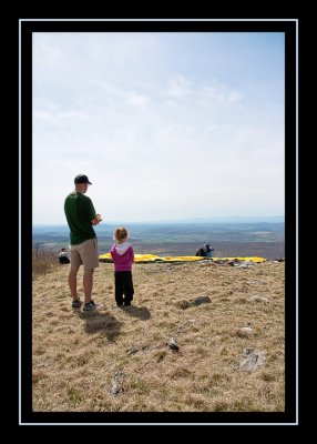 Steve and Norah watch a paraglider prepare