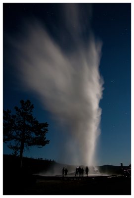 Visitors watch as Castle Geysers erupts