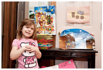 Kicking off the month with her Playmobil calendar and a book a day