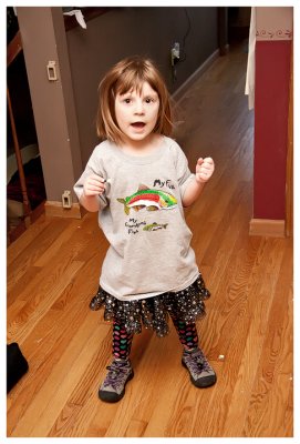 Norah put this one together - a fishing shirt paired with her new sparkly Hello Kitty skirt and heart leggings