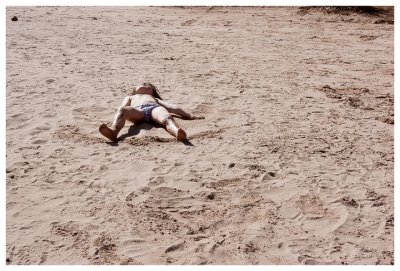 Giddy Norah doing sand angels