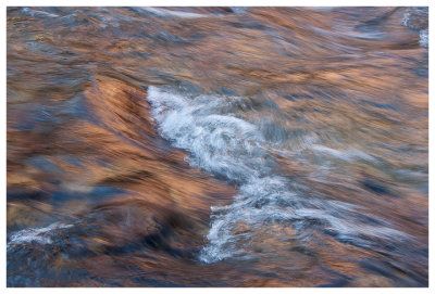 Canyon glow reflected in Bright Angel Creek