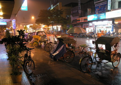 rickshaws in heavy rain