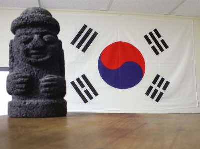 Dolharubang stone grandfather statue with Taegukgi Korean Flag