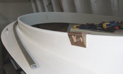 Starboard, aft coaming rim, prepped for bedding of extrusion; Teak oarlock mount in place.