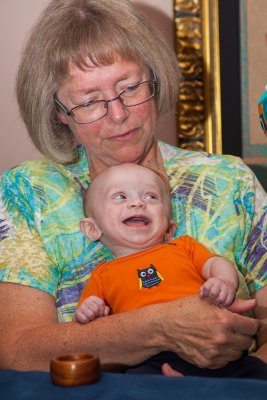 Happy to be held by Grandma