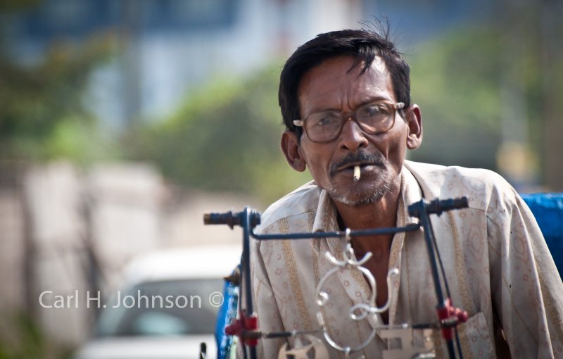 rickshaw driver having a smoke