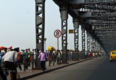 Crossing Howrah Bridge from Howard Train Station to Kolkata