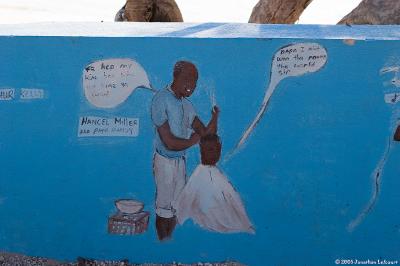 Wall in Staniel Cay with Paintings of the Locals